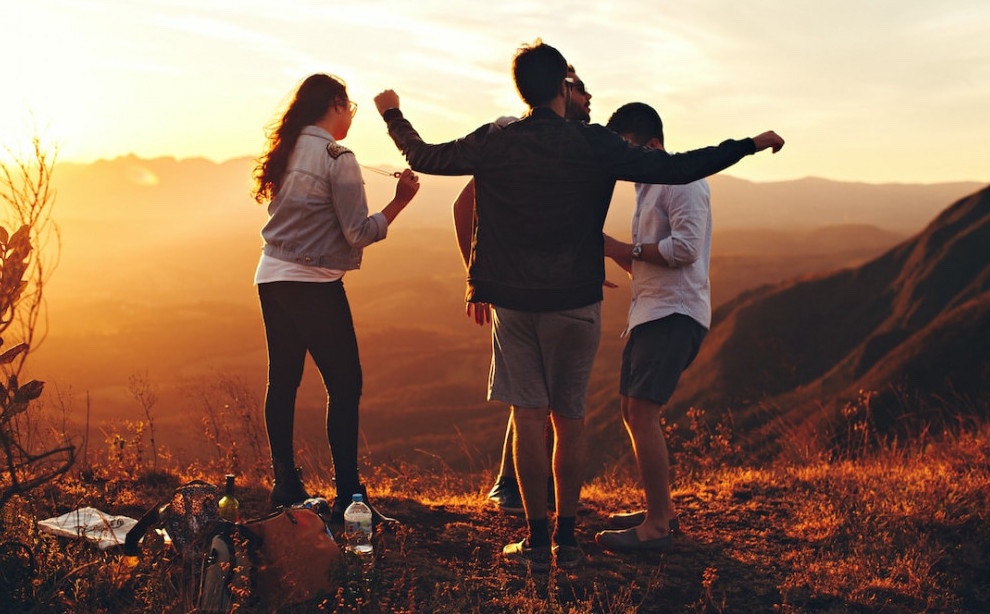 Man with teenaged kids outdoors