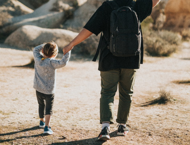 dad and child walking holding hands