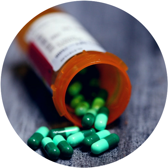 Prescription bottle with green pills