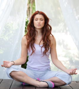 Woman sitting in yoga pose